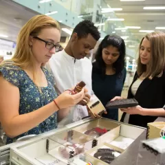 Students examine Museum collection objects as part of a Q?rius school program. Photo by Jennifer Renteria, Smithsonian.