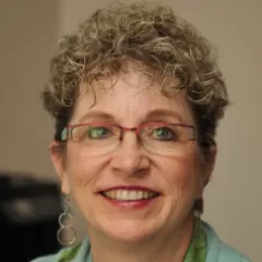 A woman smiling for a portrait photo