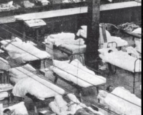 black and white photo of patients in hospital bed 