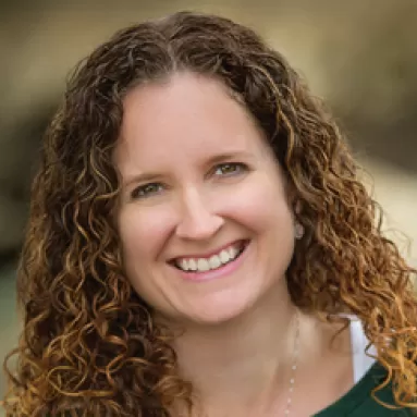 A woman smiling for a portrait photo