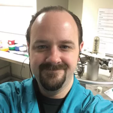 A man standing in a laboratory