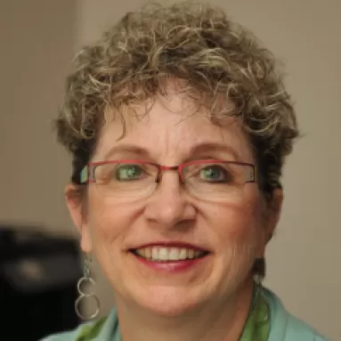 A woman smiling for a portrait photo