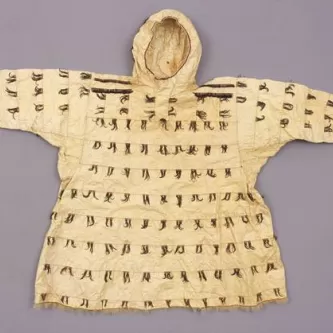 Hooded parka, made from gutskin and decorated with tufts of feathers 