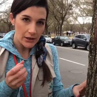 Manuela Dal Forno standing next to a tree