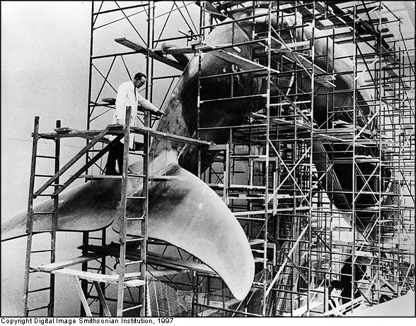 Taxidermist/modeler John Widener working on the model of the giant blue whale